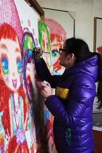Click for Poon Shu Gallery - Ms. Poon Shu in her Studio