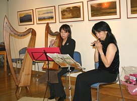 Mrs. Kiyoko Yoshida Playing the Harp - copyright Ryusei Okamoto