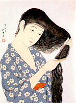 Woman combing her hair - 